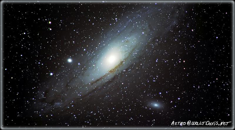 The great M31 (Andromeda Galaxy) is seen with its smaller companion galaxies M32 and M110. M31 is the nearest spiral galaxy to our spiral galaxy the Milky Way. This picture was taken with a Nikon D70 and 600mm f4 ED lens. By Walt Davis.